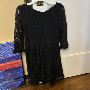 In great used condition. Black lace little girl dress